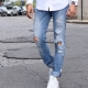 Ripped mænds jeans: hvad er de, og hvad skal de have på?