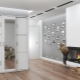 White wardrobes in the interior of the hallway