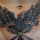 Pregled muških tetovaža na trbuhu i nijanse njihove primjene